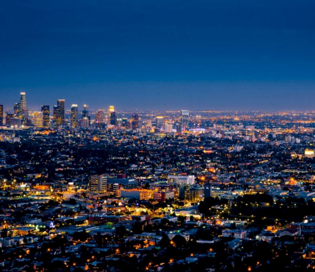 A city skyline at night with many lights