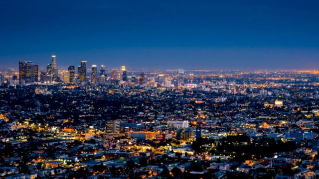 a city skyline at night with many lights