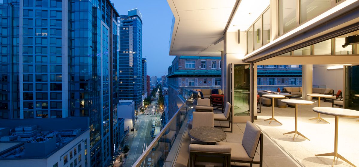 A balcony with a city view at evening